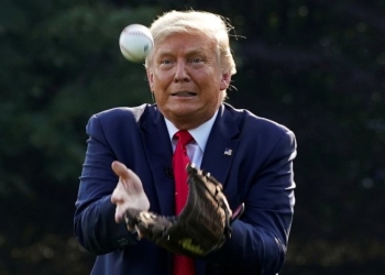 U.S. President Donald Trump catches a ball while hosting youth baseball players at the White House on opening day for Major League Baseball, in Washington, U.S., July 23, 2020.  REUTERS/Kevin Lamarque     TPX IMAGES OF THE DAY