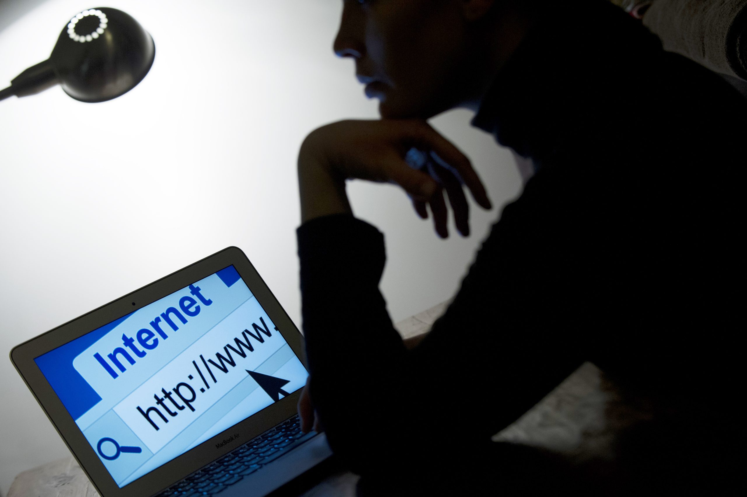 A woman looks at a webpage while connecting on the internet on March 15, 2013 in Paris.    AFP PHOTO / LIONEL BONAVENTURE        (Photo credit should read LIONEL BONAVENTURE/AFP/Getty Images)